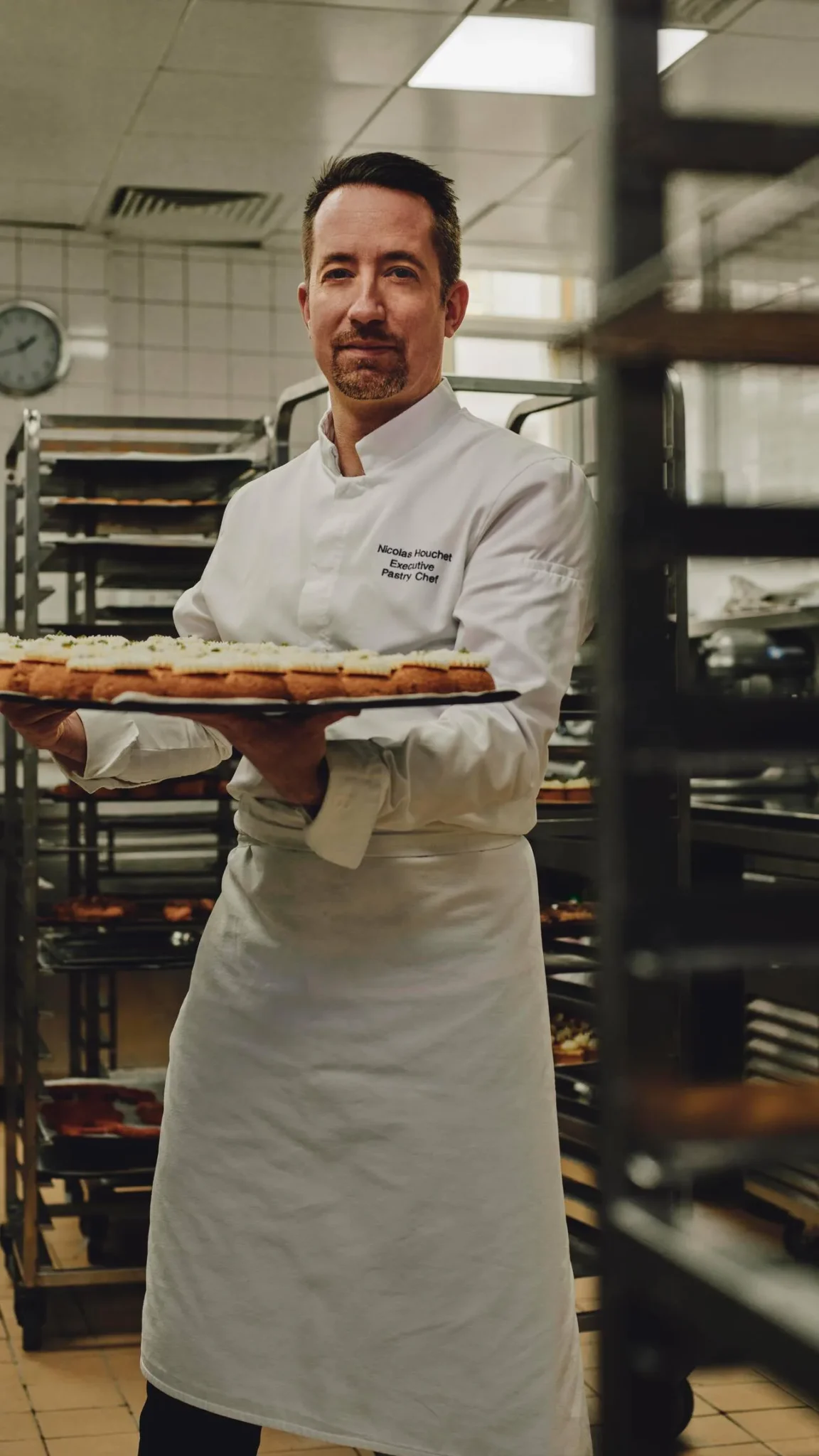 Photo of Nicholas, the executive pastry chef, showcasing the hotel's Instagram strategy by highlighting skilled staff, including butlers and bartenders crafting cocktails with passion and flair.